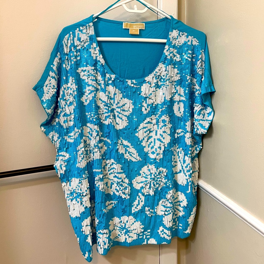 606).  Sequined top